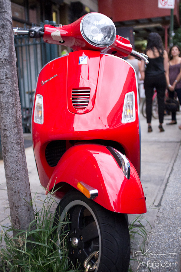 Red Vespa in front of Grand Opening